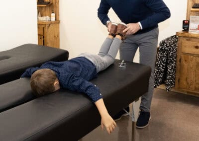 Child receiving chiropractic care at Ignite Fargo clinic for spinal health.