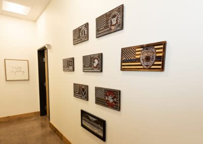 Decorative plaques with American flags and patriotic themes in chiropractic office.