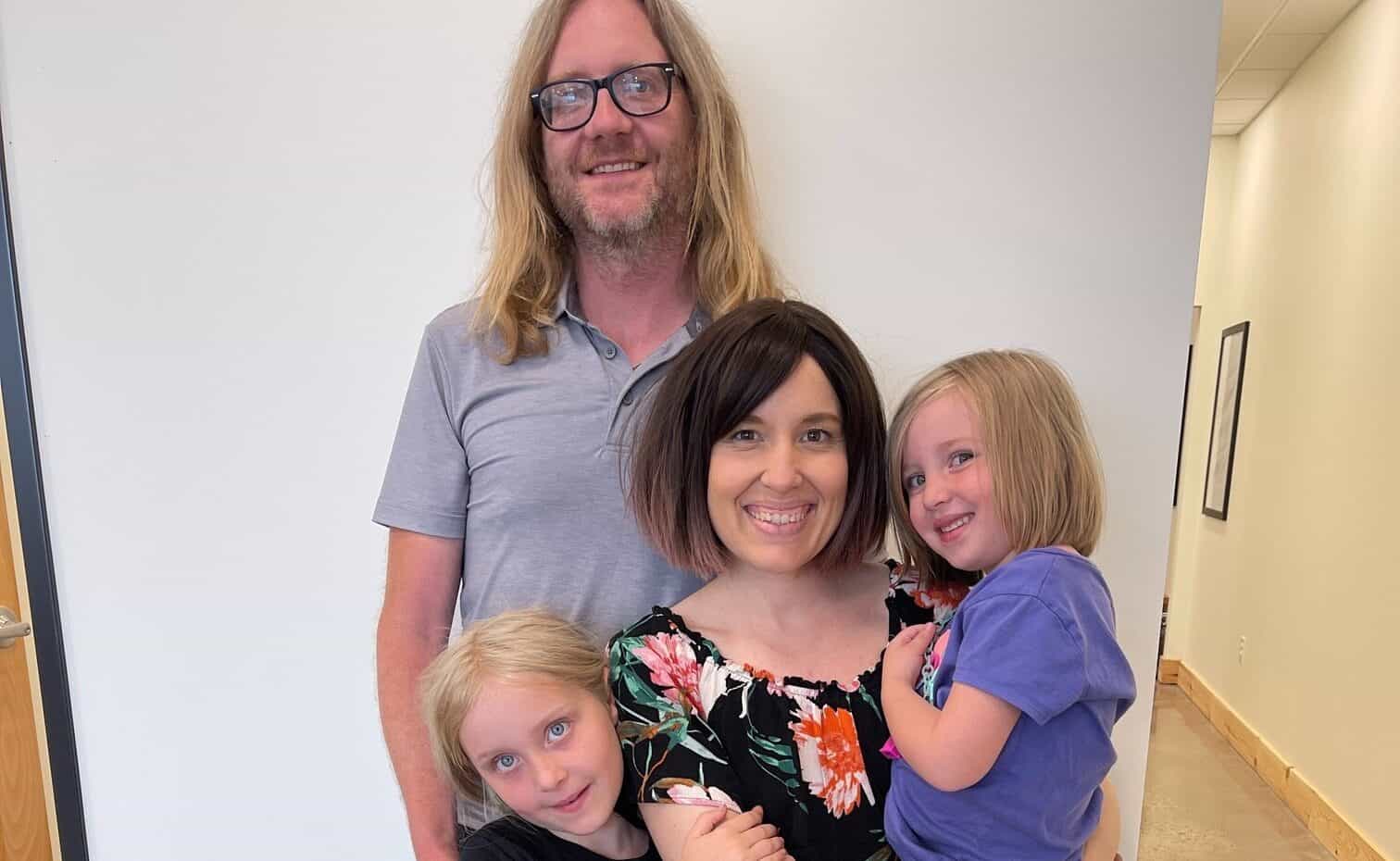 Happy family with children at Ignite Chiropractic for health and wellness.