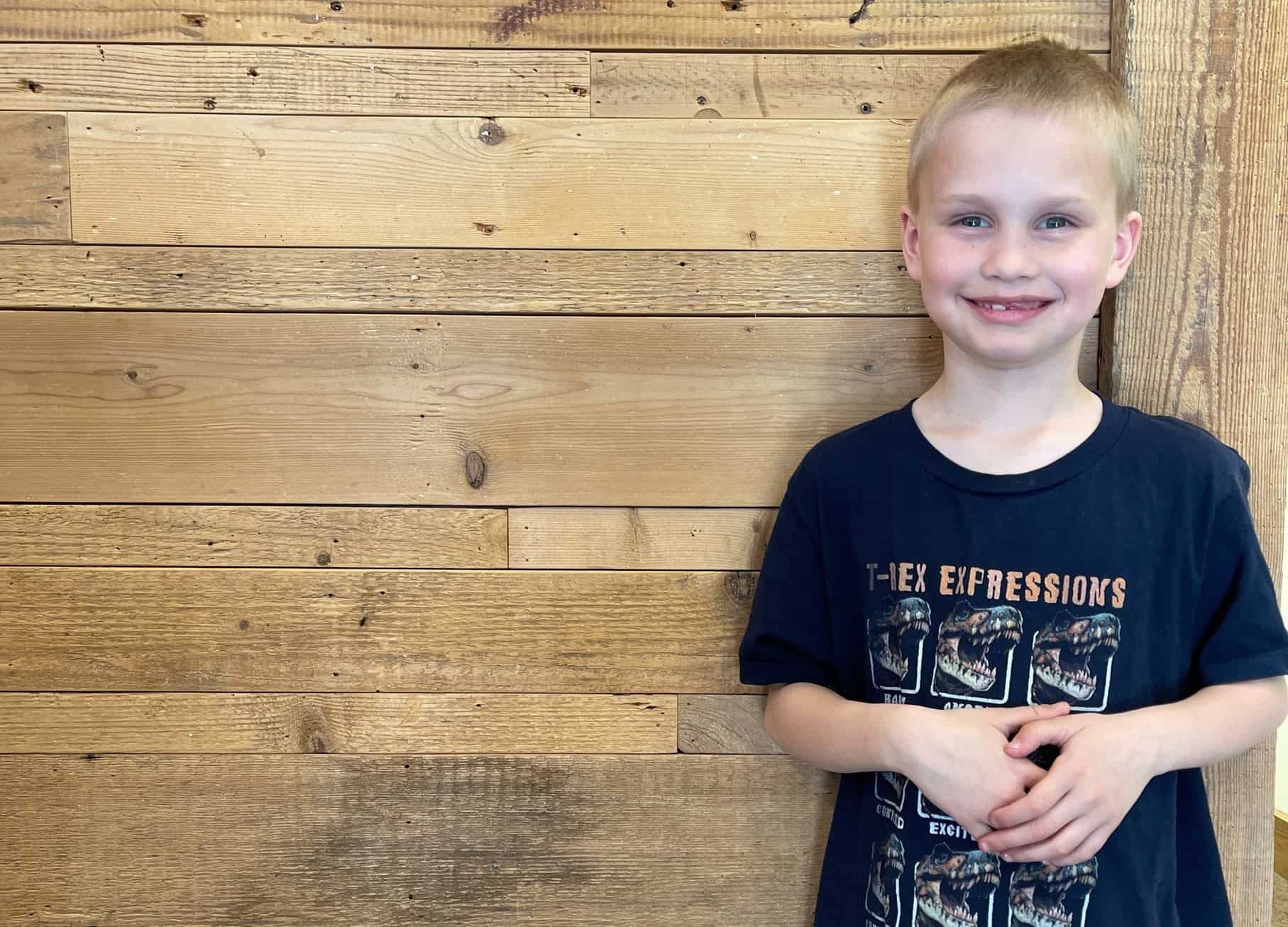 Smiling young boy at Ignite Chiropractic clinic in Fargo.